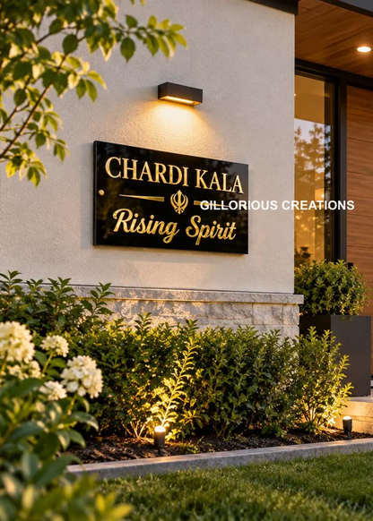 Black and mirror gold Chardi Kala acrylic wall sign mounted at a modern home entrance